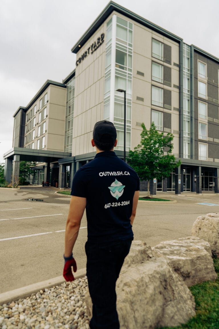 Outwash technician walking towards a hotel building