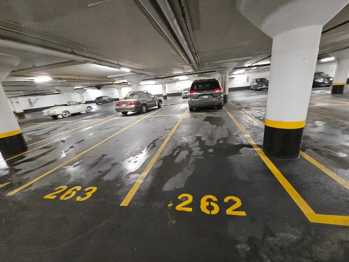 Numbered stalls in an underground parking garage